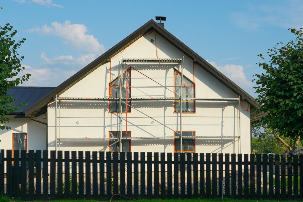 House needing repairs with scaffolding sold as-is to cash buyers